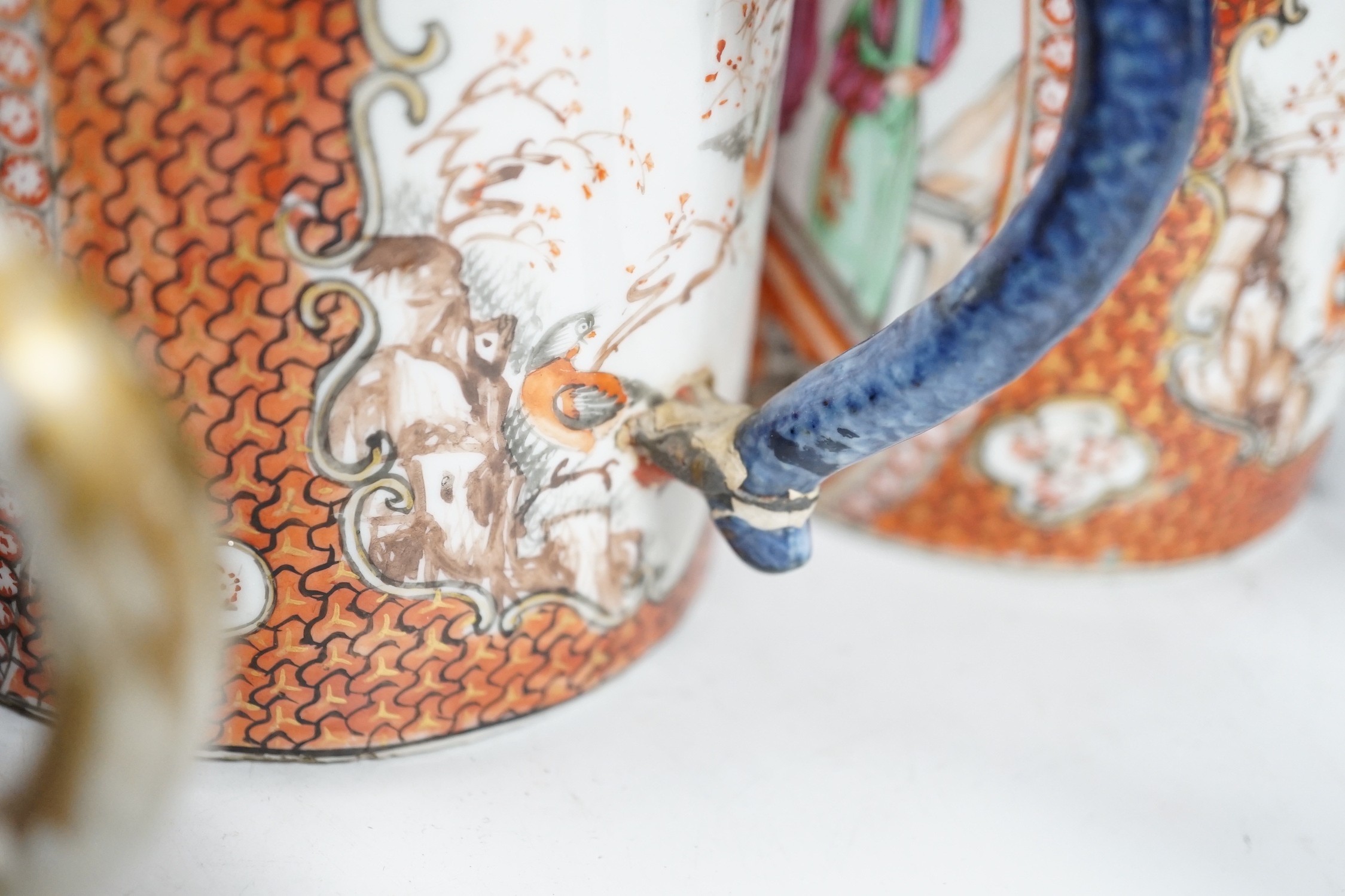 Two Chinese export 'mandarin' mugs and a similar teapot, Qianlong period, tallest mug 14cms high